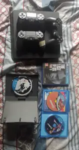PS4 Slim with 3 controllers and 9 games