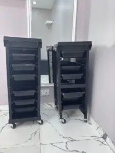 Black salon trolley cart with styling storage