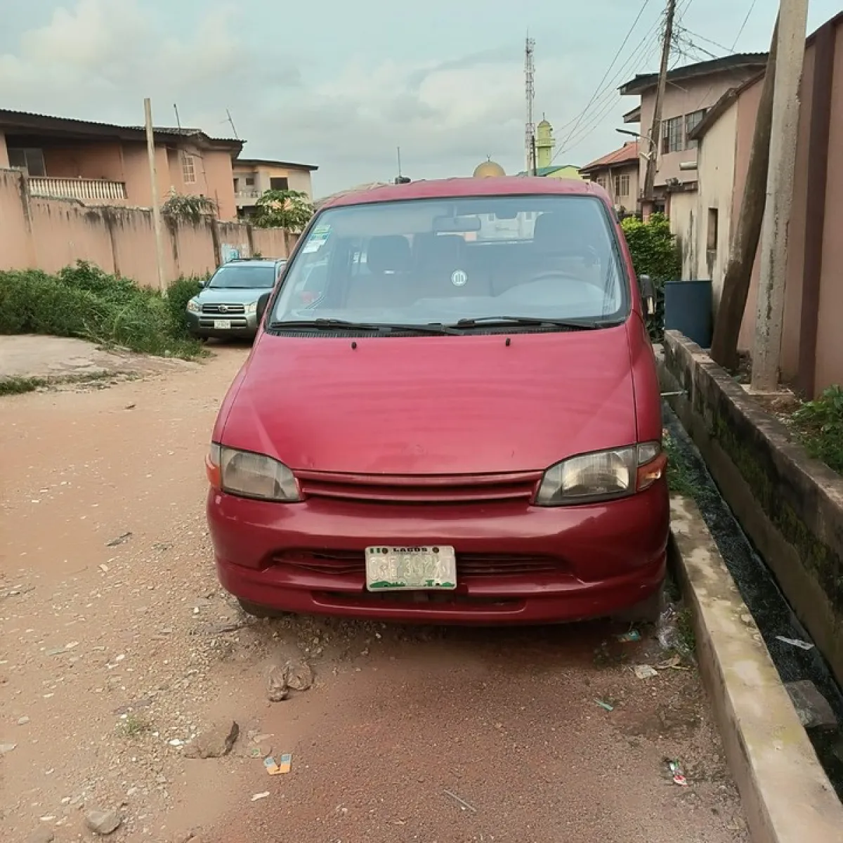 Red Toyota hiace bus - Image 1
