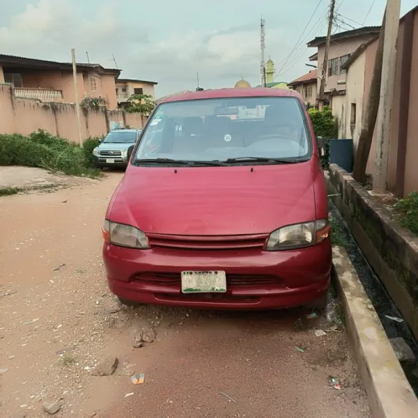 Red Toyota hiace bus