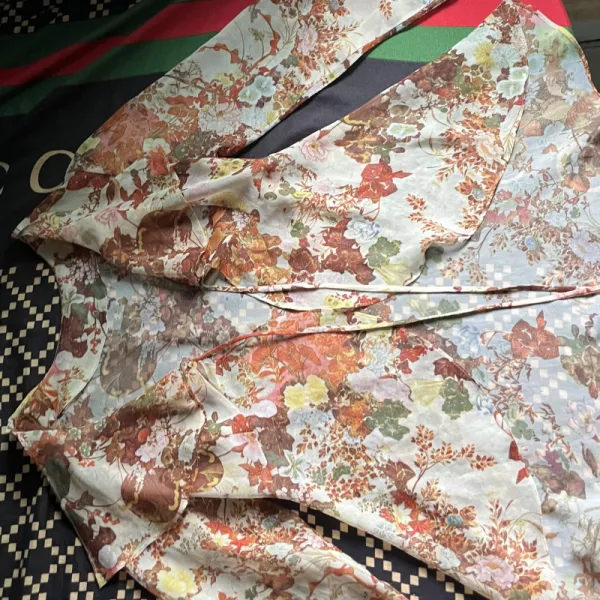 long-sleeve floral peplum blouse with layeredruffled fron